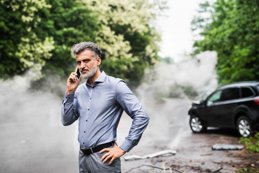 mature-man-making-a-phone-call-for-tow-truck