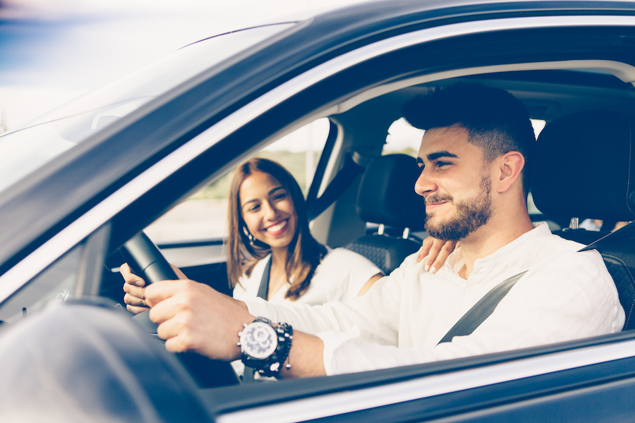 Profile of a man driving a car