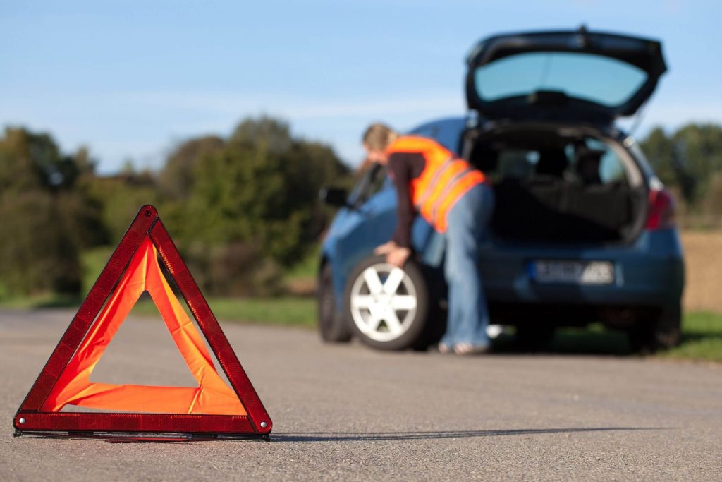 motorist changing tire