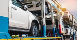 Multiple vehicles loaded on a transport truck for car transportation