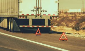 A broken down semi-truck needing commercial truck roadside assistance.