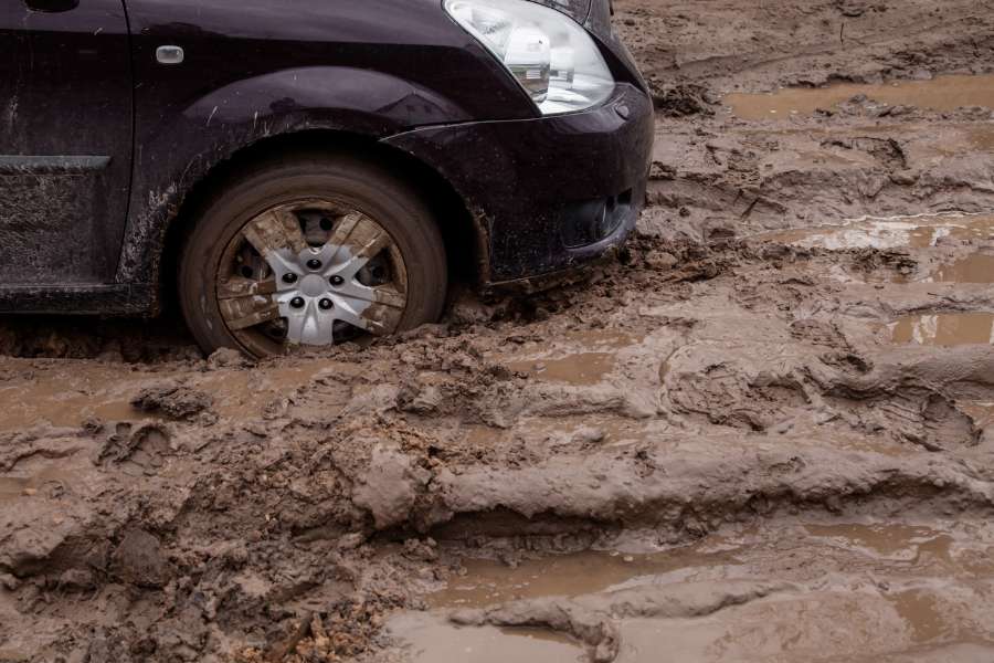 car stuck in the mud needs assistance