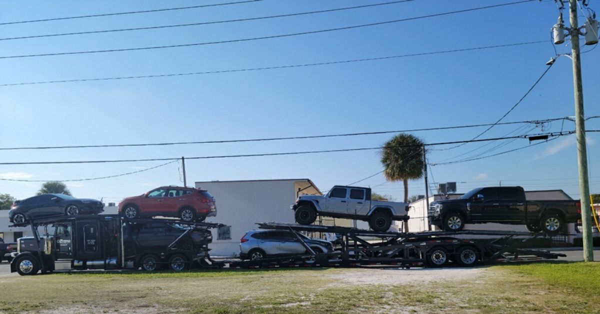 Auto Transport 4 Geyers open car carrier transporting vehicles along the East Coast
