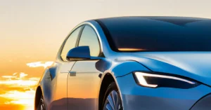 Close-up of a Tesla car's front at Sunset