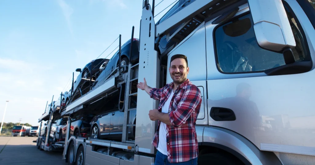 Man beside a car transport trailer, emphasizing "is it worth shipping your car.