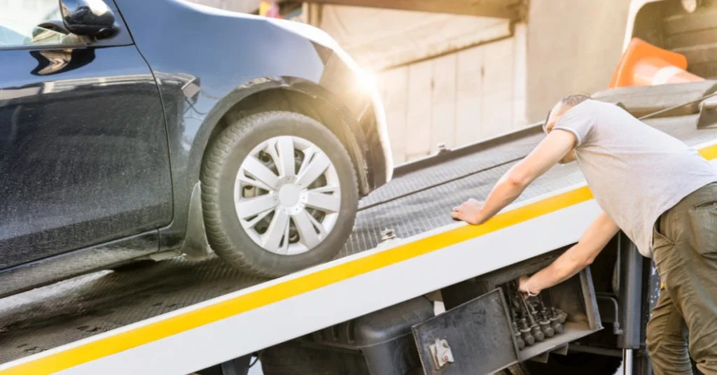 Car being loaded onto a tow truck.