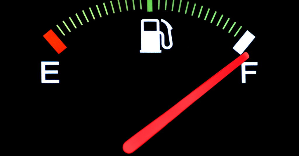 Close-up of a car fuel gauge showing a full tank