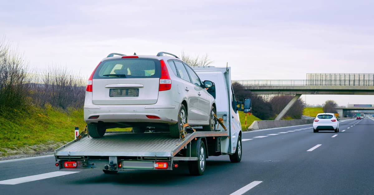 The cost to tow a car 100 miles